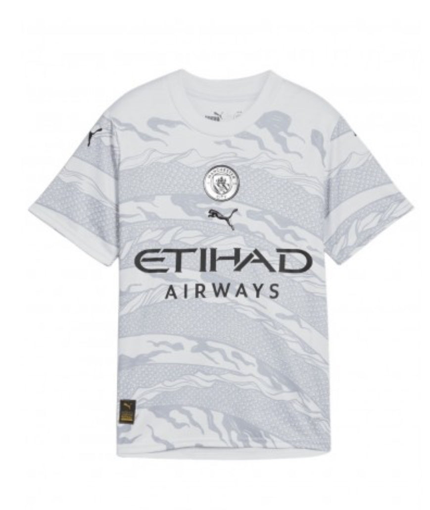 PUMA MANCHESTER CITY FC YEAR OF THE DRAGON JUNIOR JERSEY 2023/24